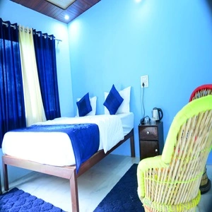 Comfortable room of Musafir resort provided in our do dham tour package